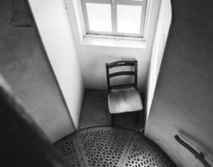 Chair next to a window in a lighthouse