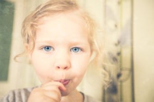 Daughter eating a sucker